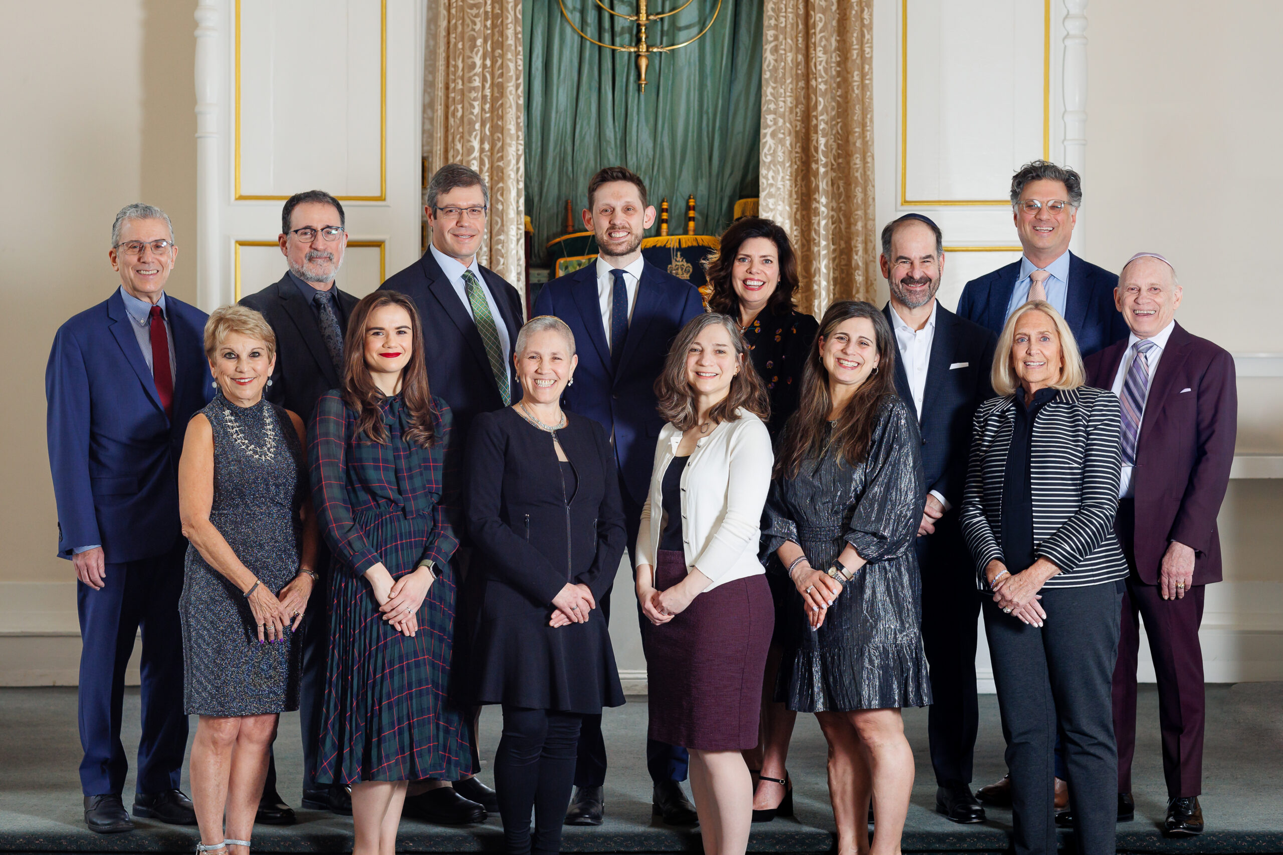 Society Hill Synagogue's Board of Directors 2024 standing on the Bimah in our Sanctuary.